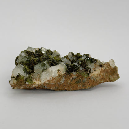 forest epidote cluster with clear quartz